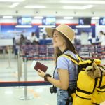 Traveler with passport at airport check-in